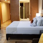 Hotel room offers comfort after traveling, tourism, hospitality business, cozy hotel accommodation